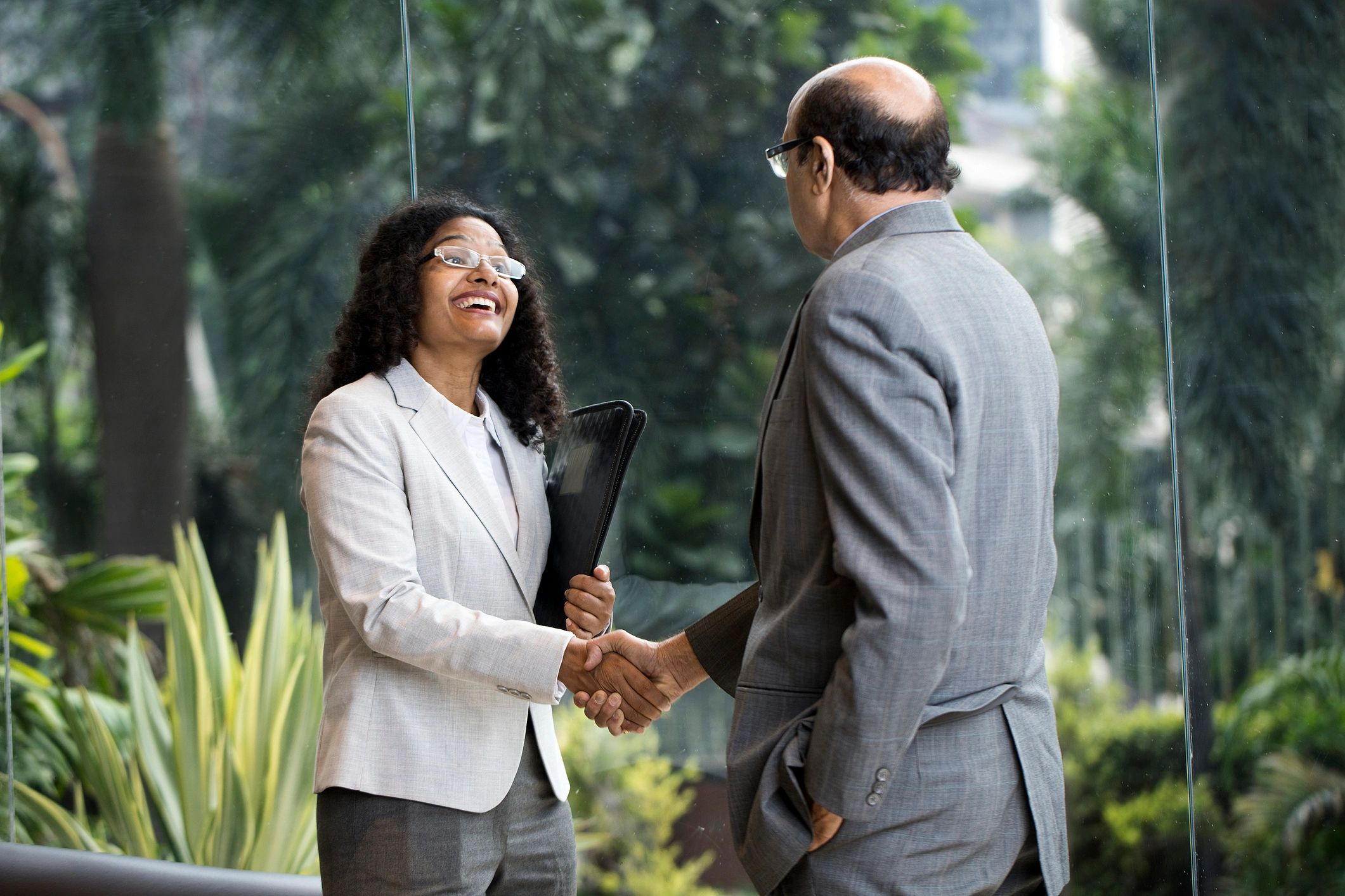 Indian business man and woman in their 40s with a premium, trustworthy feel