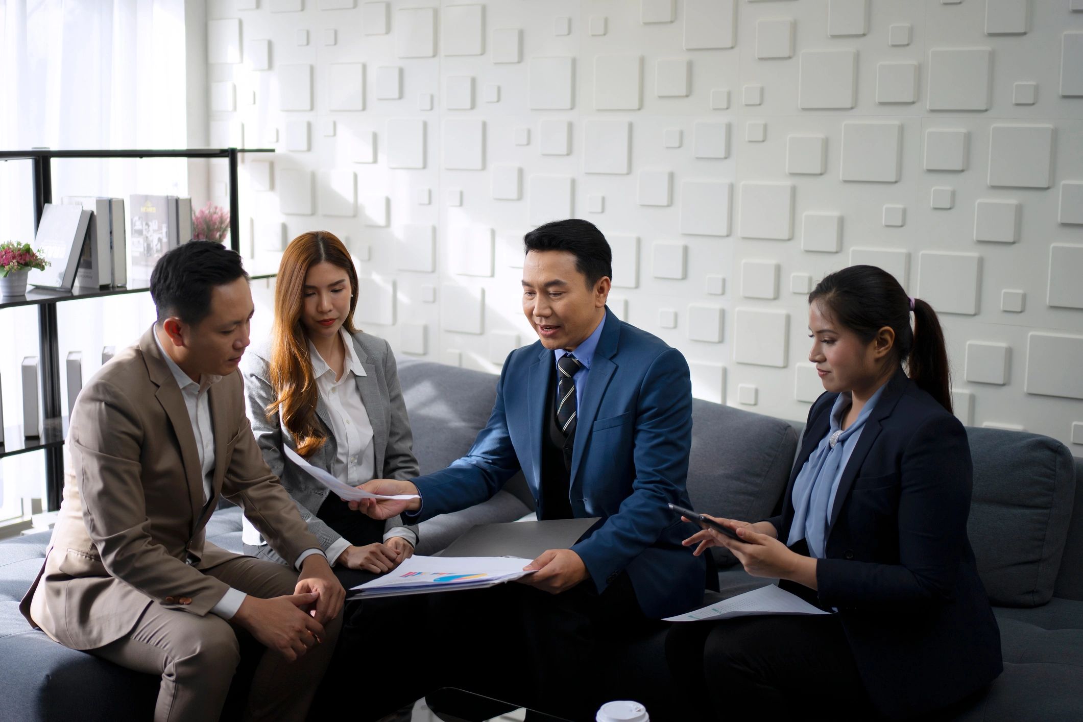Professional advisory team in a premium office meeting