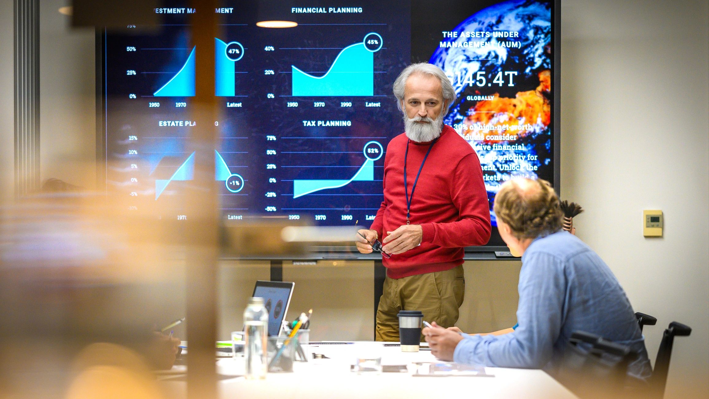 Senior man presenting report in meeting room